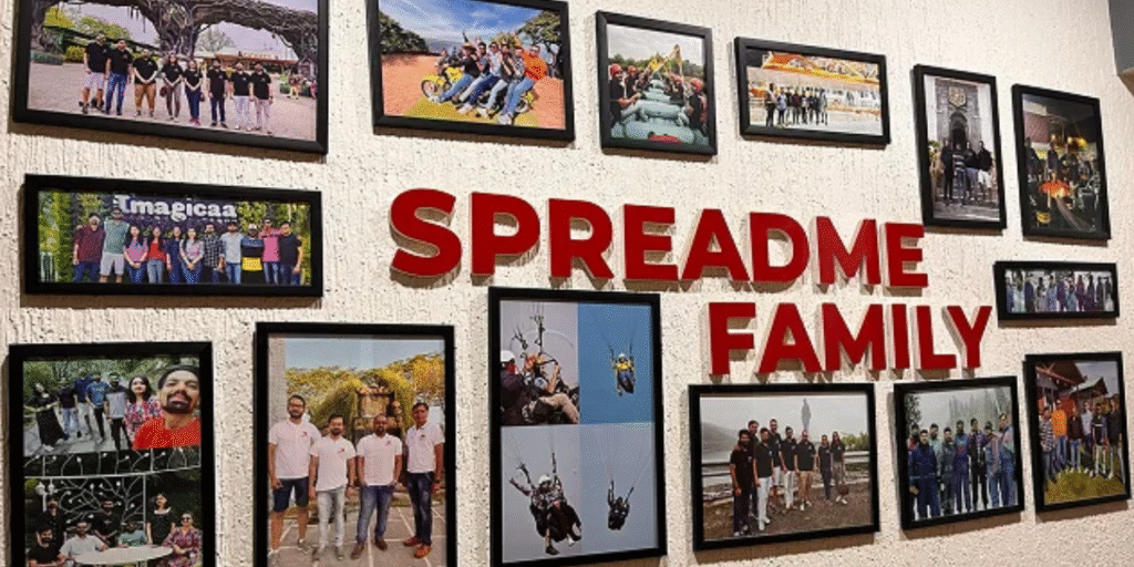 Wall collage featuring team outing photos of Spreadme, a Digital Marketing Agency in Gandhinagar, showcasing employee bonding and company culture under the title 'Spreadme Family'.